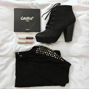 Black short sleeve top with gold spiked shoulders